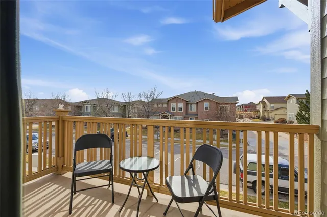a view of a balcony with furniture