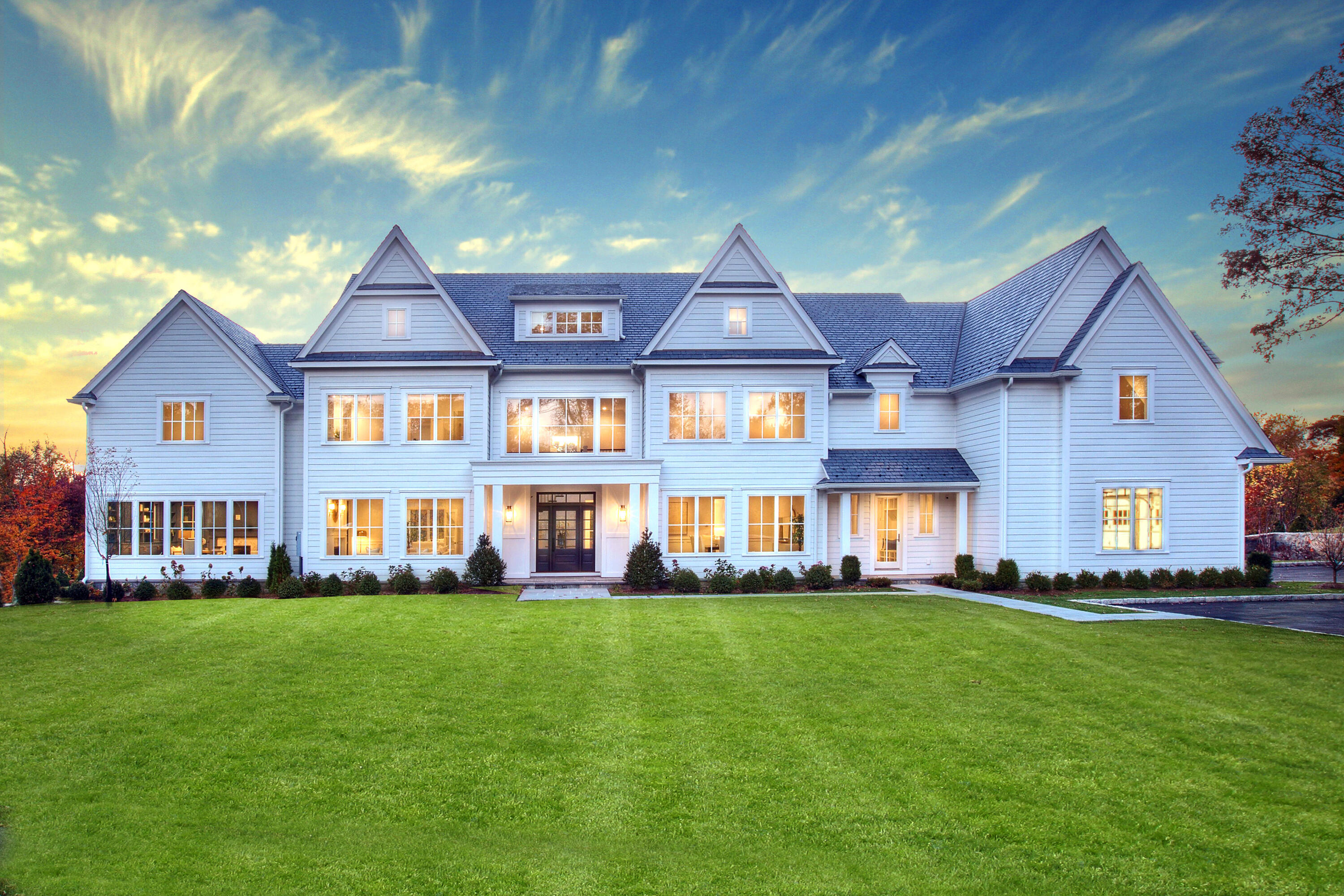 99 Turtle Back Road South New Canaan, CT 06840 - Photo 1 of 34 a front view of a house with a yard