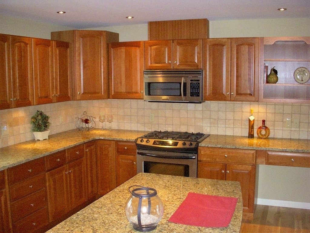 16 Sunderland Road Montague, MA 01351 - Photo 4 of 9 a kitchen with stainless steel appliances granite countertop a sink stove and cabinets