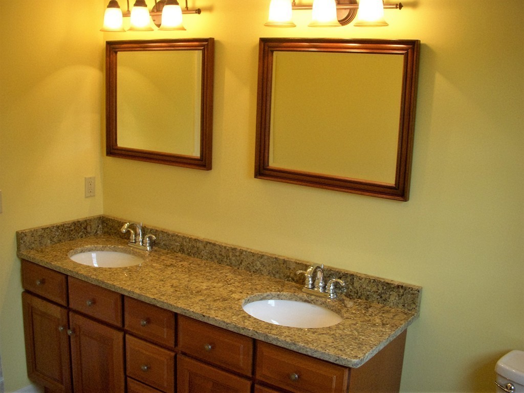 16 Sunderland Road Montague, MA 01351 - Photo 8 of 9 a bathroom with a granite countertop sink and a mirror
