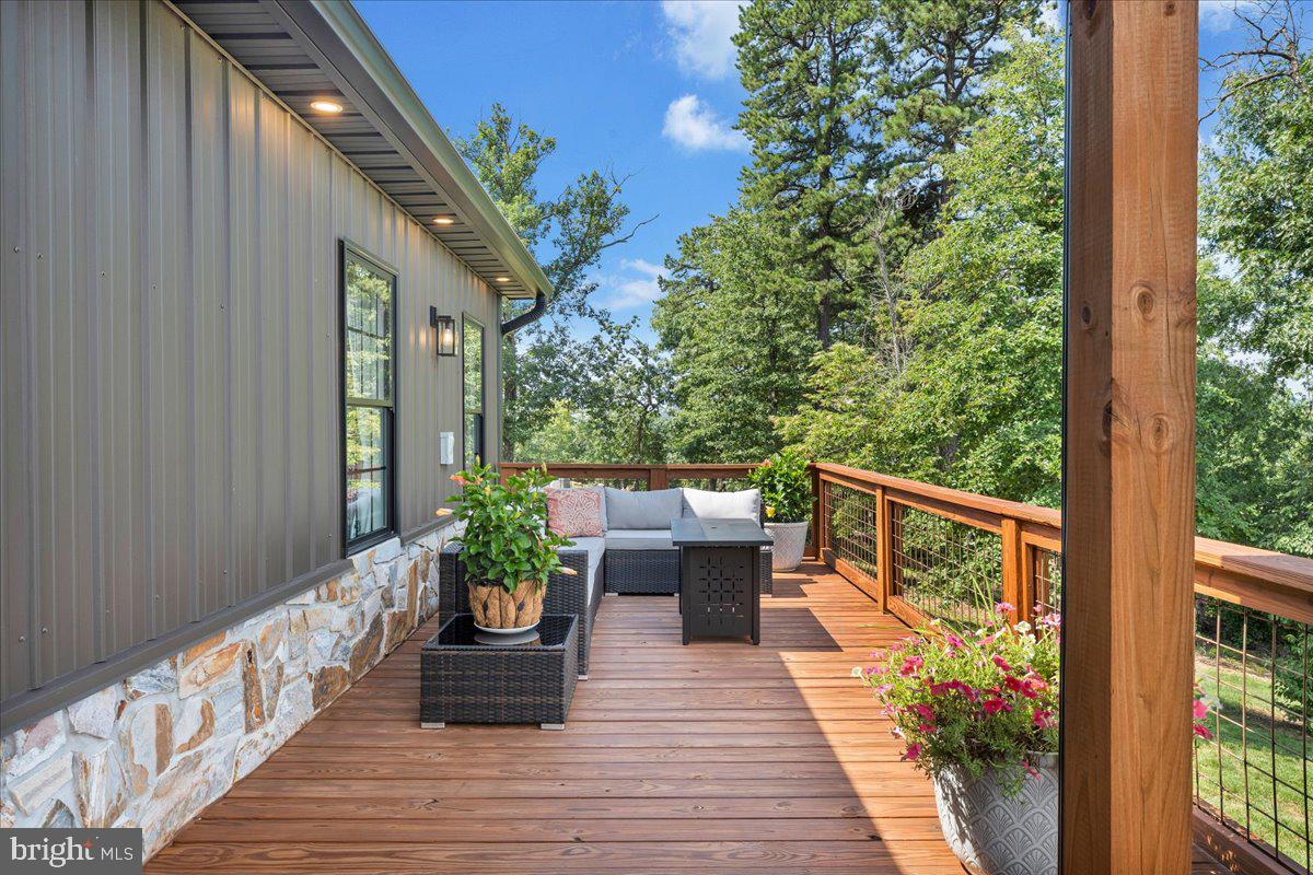 415 Grahams Farm Road Stuart, VA 24171 - Photo 80 of 121 Serene deck with lush green backdrop.