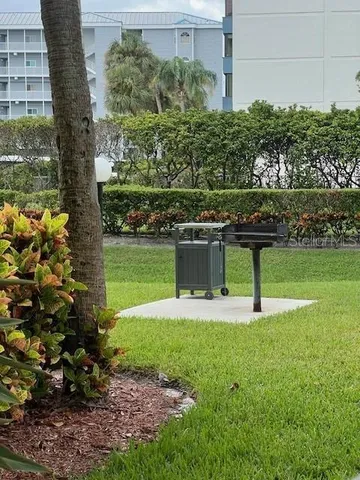 a view of a wooden table and chairs in patio