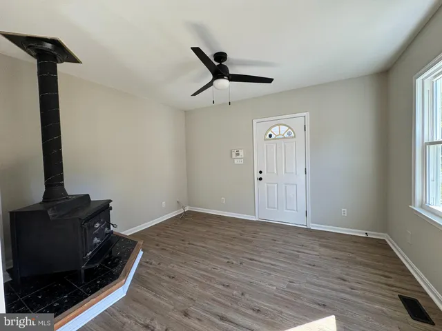 a view of kitchen with window and wooden floor