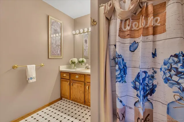 a bathroom with a sink and a mirror