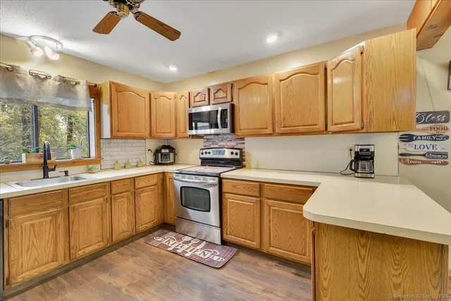 a kitchen with a sink cabinets and window