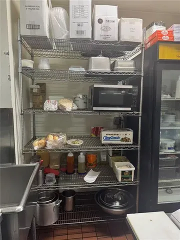 a room with water heater and a wooden floor