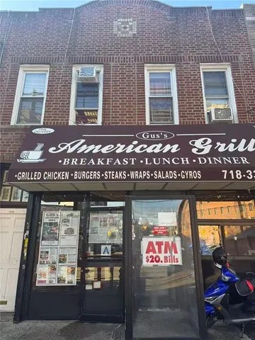 a front view of a brick building with many windows