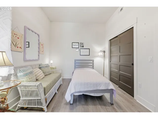 a bedroom with a bed and a cabinets