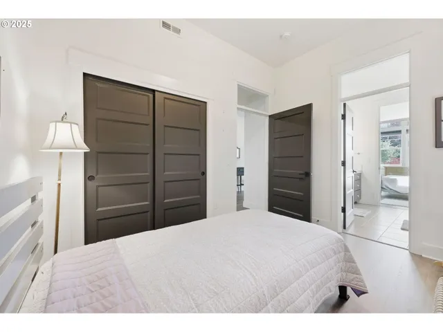 a bedroom with a bed and a dresser