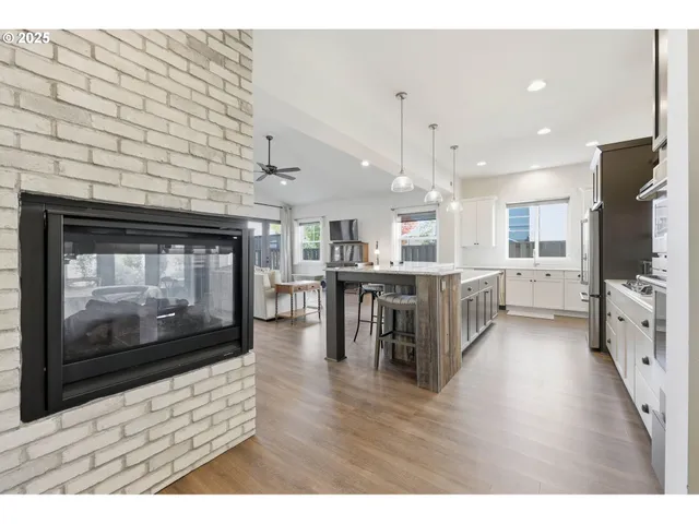 a view of kitchen with furniture and wooden floor