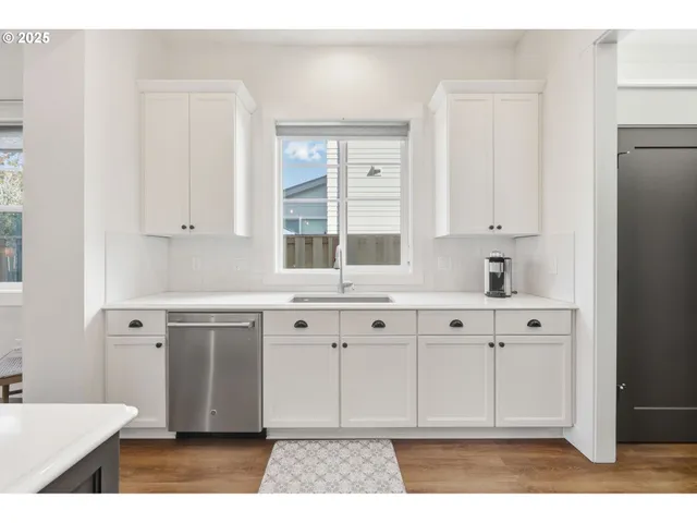 a kitchen with a sink stove and refrigerator