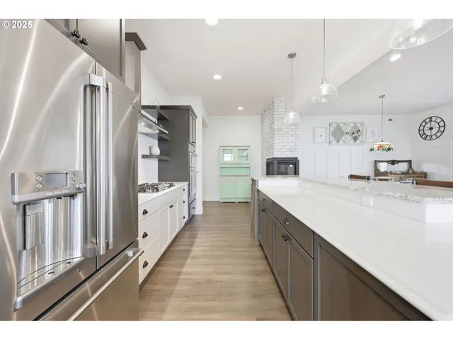 a kitchen with kitchen island wooden cabinets and counter space