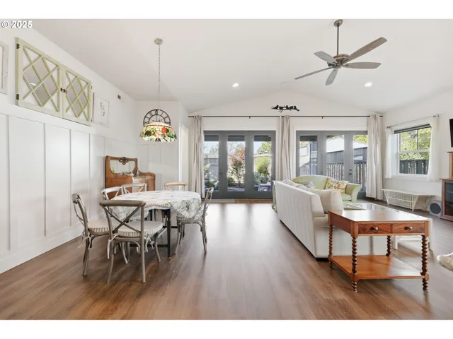 a view of a dining room with furniture and chandelier