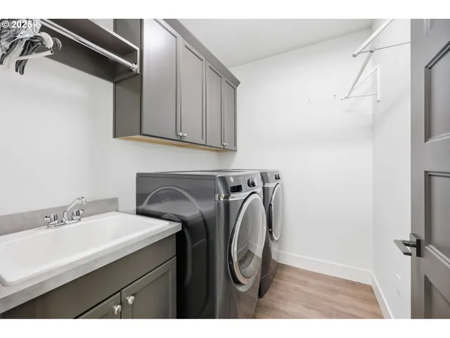 a bedroom with a bed a couch and dresser