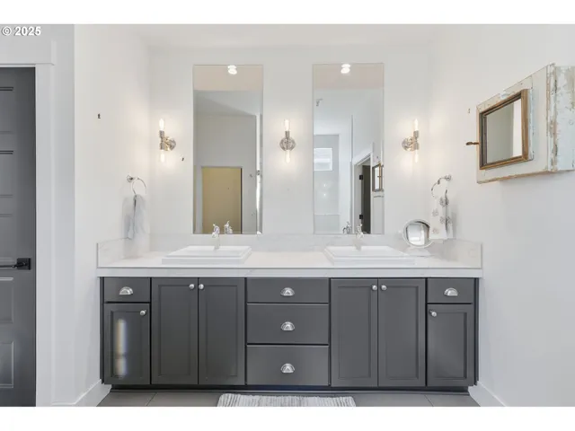a bathroom with a glass shower door and a bathtub