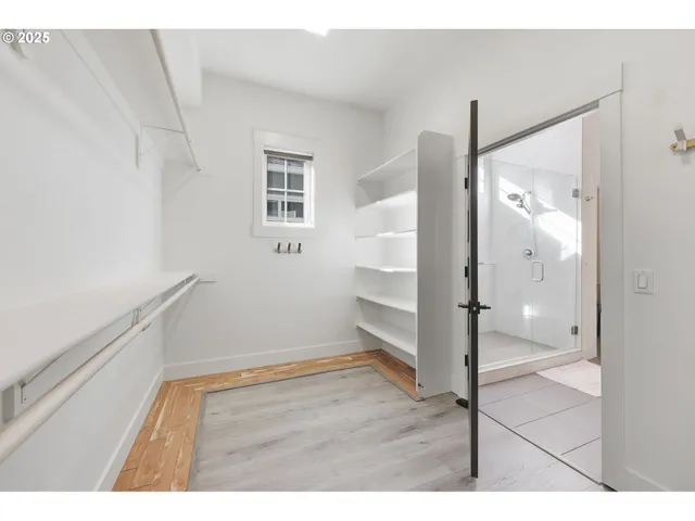 a bathroom with a glass shower door
