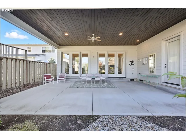 a view of a patio with a table chairs and a patio