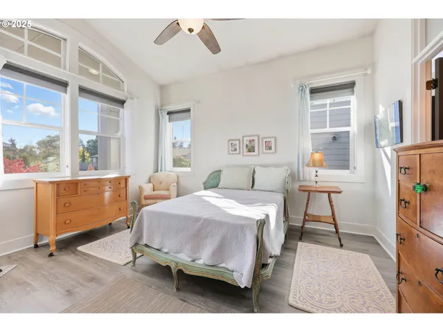 a bedroom with a bed and a table