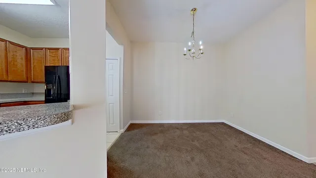 a view of a hallway to a bedroom