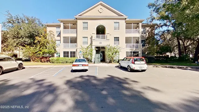 a view of a street with cars parked