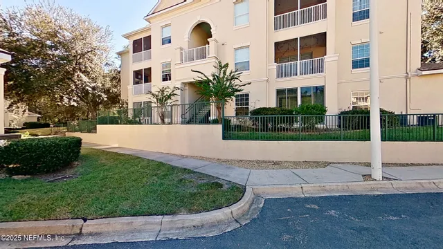 a view of a building with a yard