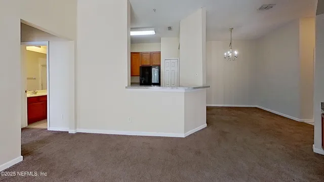 an empty room with a bathroom