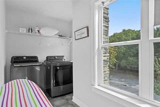 a bathroom with a double vanity sink toilet and shower