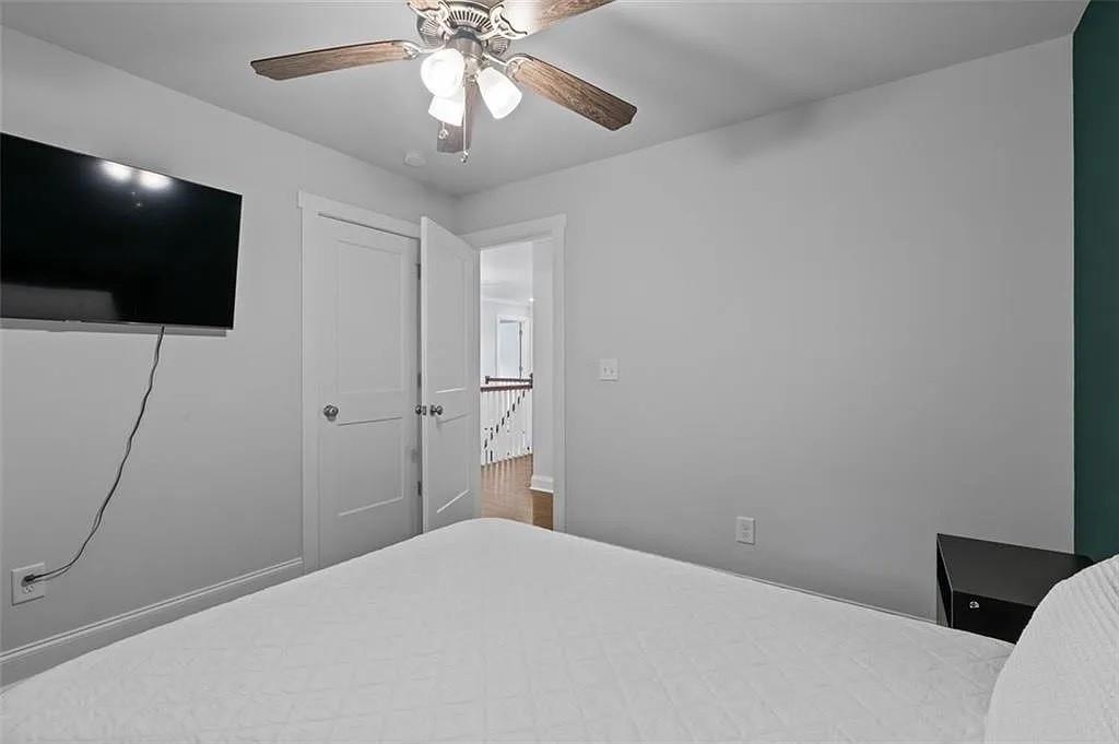 813 Coleman Street Southwest Atlanta, GA 30310 - Photo 29 of 39 a bedroom with a bed and a flat screen tv