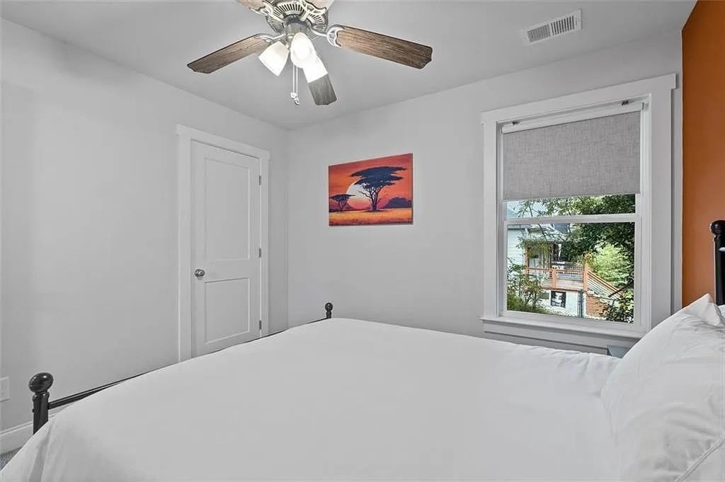 813 Coleman Street Southwest Atlanta, GA 30310 - Photo 31 of 39 a bedroom with a large bed and a window