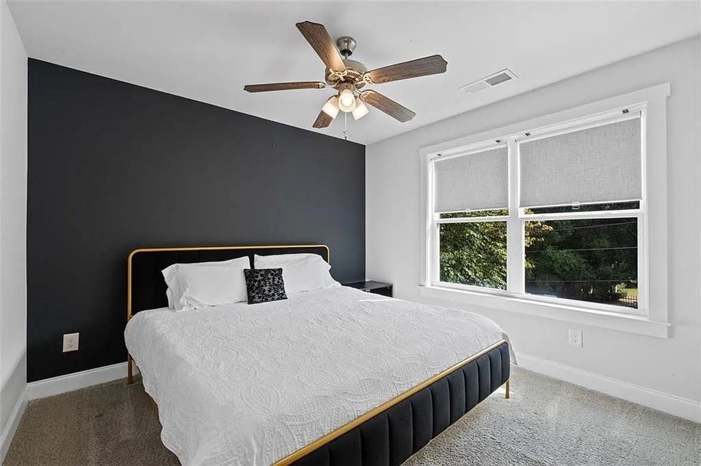 813 Coleman Street Southwest Atlanta, GA 30310 - Photo 33 of 39 a bedroom with a large bed and a large window
