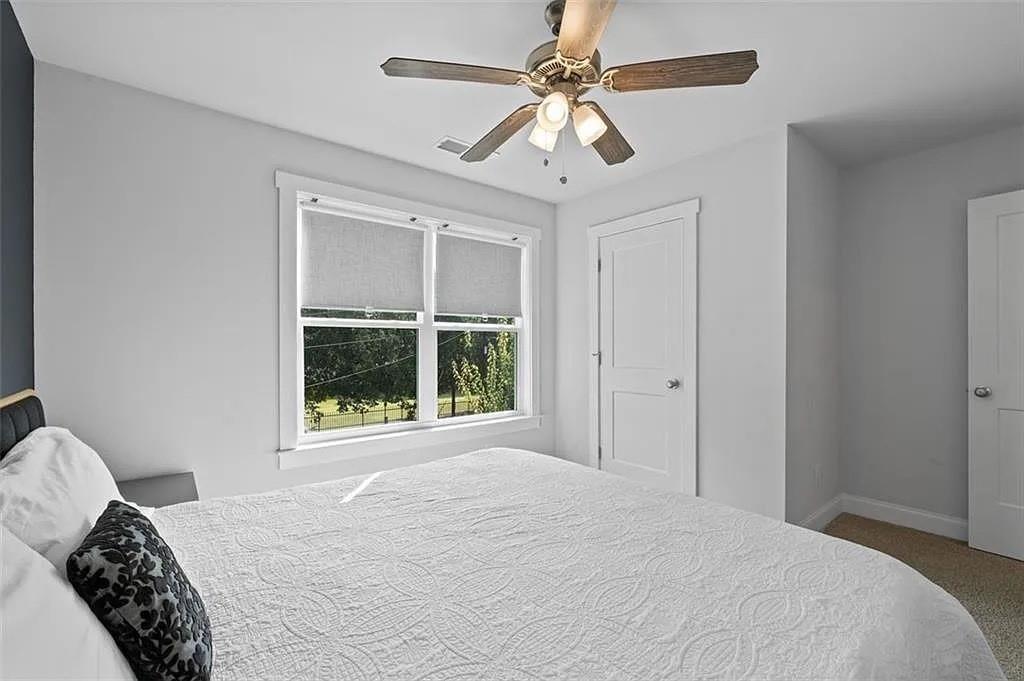 813 Coleman Street Southwest Atlanta, GA 30310 - Photo 34 of 39 a bedroom with a large bed and a window