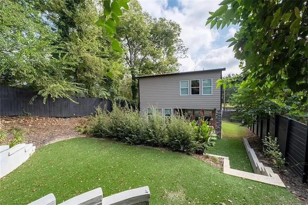 813 Coleman Street Southwest Atlanta, GA 30310 - Photo 37 of 39 a view of backyard with potted plants and a large tree