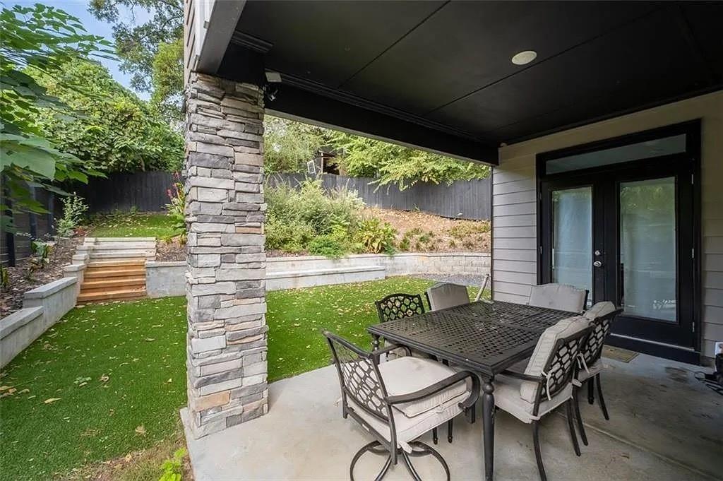 813 Coleman Street Southwest Atlanta, GA 30310 - Photo 39 of 39 a view of a patio with table and chairs and potted plants