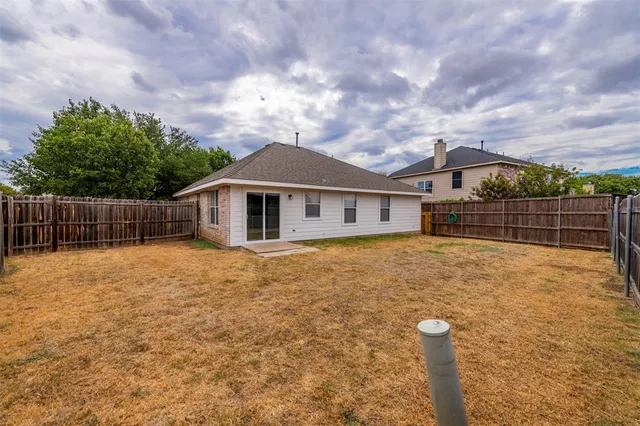a backyard of a house with lots of green space