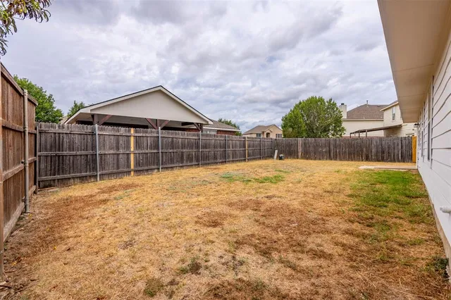 a backyard of a house with lots of green space