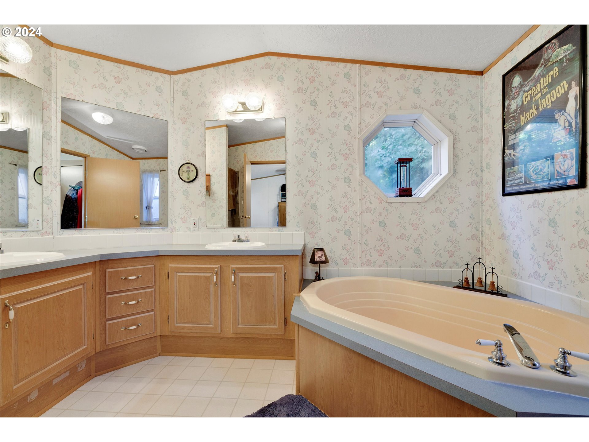 8750 Southeast 155th Avenue, Unit 53 Happy Valley, OR 97086 - Photo 22 of 29 a bathroom with a tub a sink and a mirror