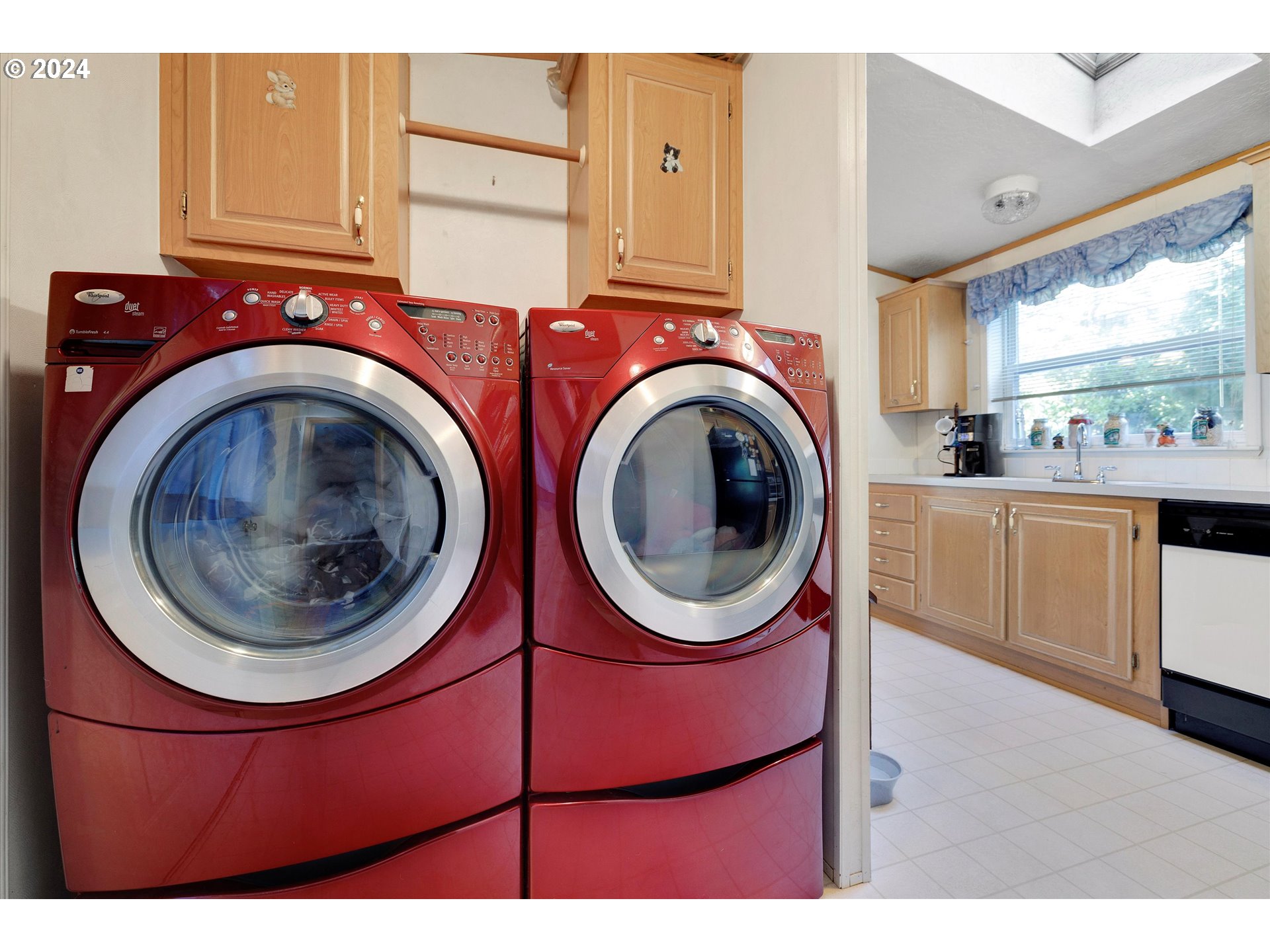 8750 Southeast 155th Avenue, Unit 53 Happy Valley, OR 97086 - Photo 29 of 29 a view of a kitchen with a washer and dryer