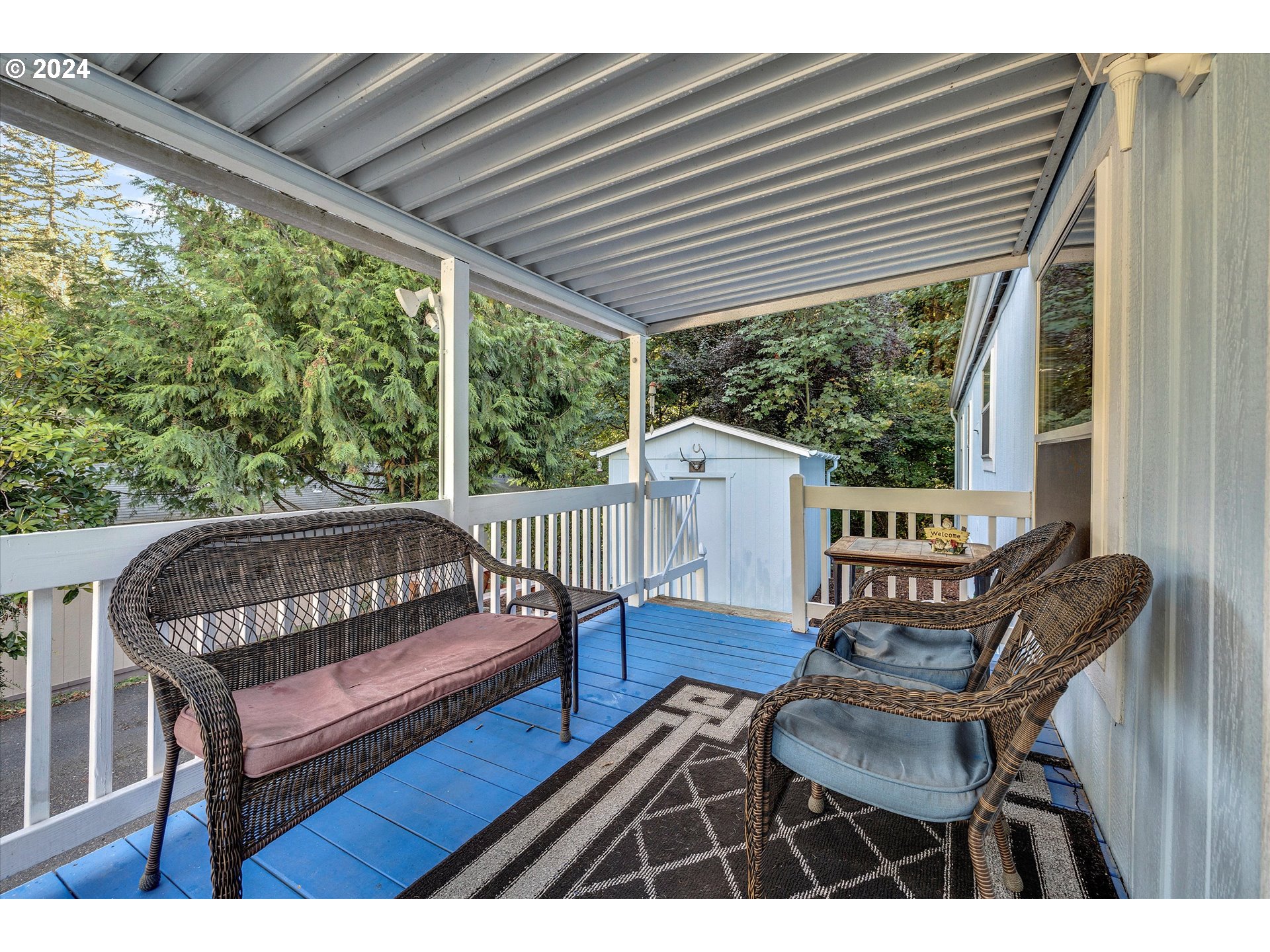 8750 Southeast 155th Avenue, Unit 53 Happy Valley, OR 97086 - Photo 7 of 29 a view of a chairs in wooden deck