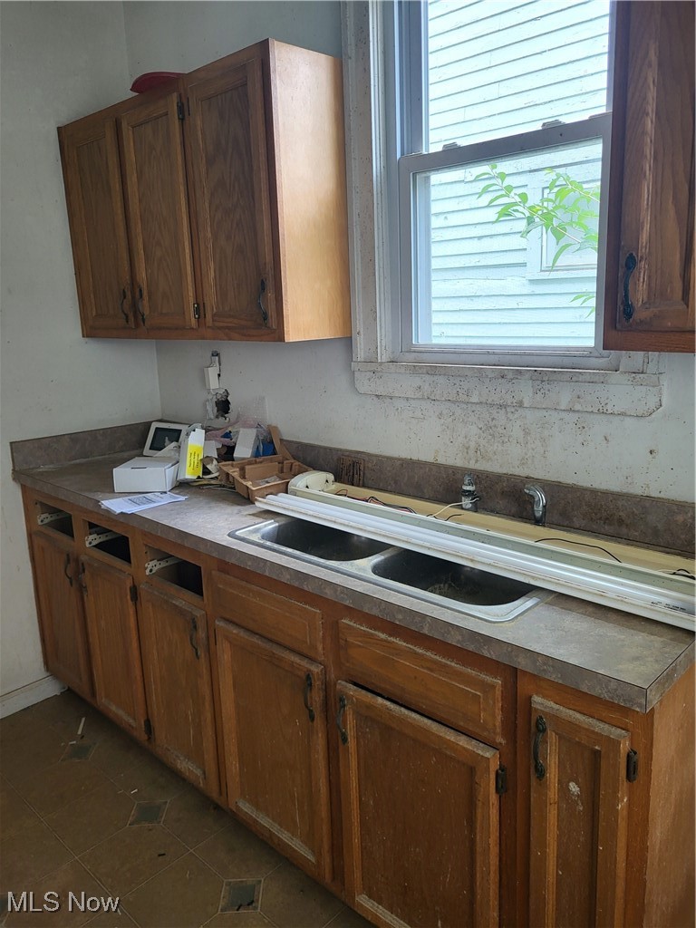 3201 East 118th Street Cleveland, OH 44120 - Photo 11 of 13 Kitchen with dark tile patterned floors