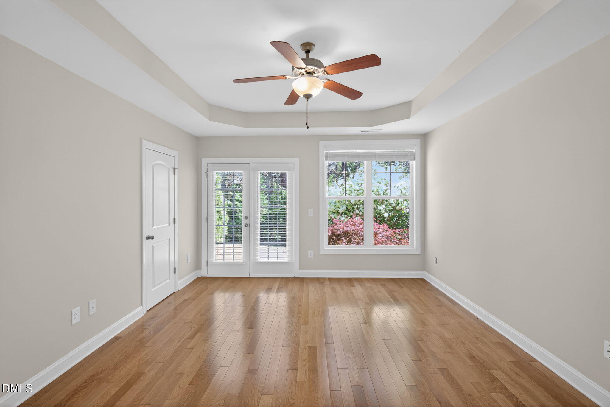 3834 Cumberland Pond Road Raleigh, NC 27606 - Photo 14 of 31 a view of an empty room with wooden floor and a window