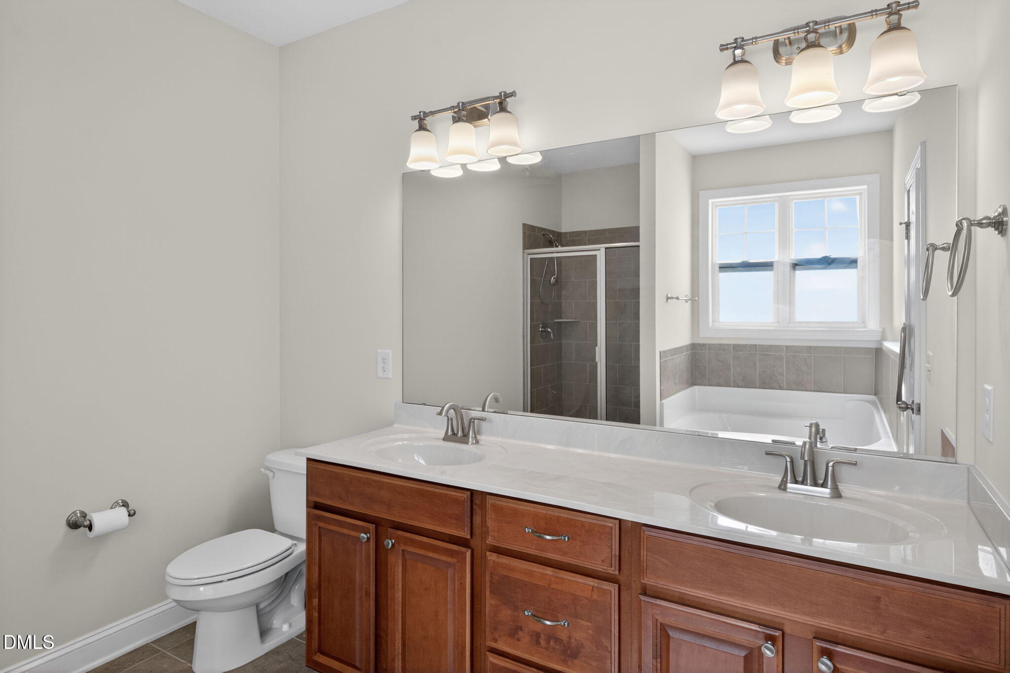 3834 Cumberland Pond Road Raleigh, NC 27606 - Photo 16 of 31 a bathroom with a sink and a toilet