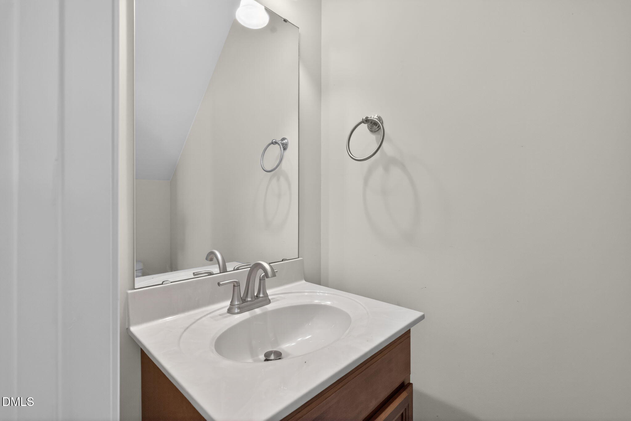 3834 Cumberland Pond Road Raleigh, NC 27606 - Photo 18 of 31 a bathroom with a sink and a mirror