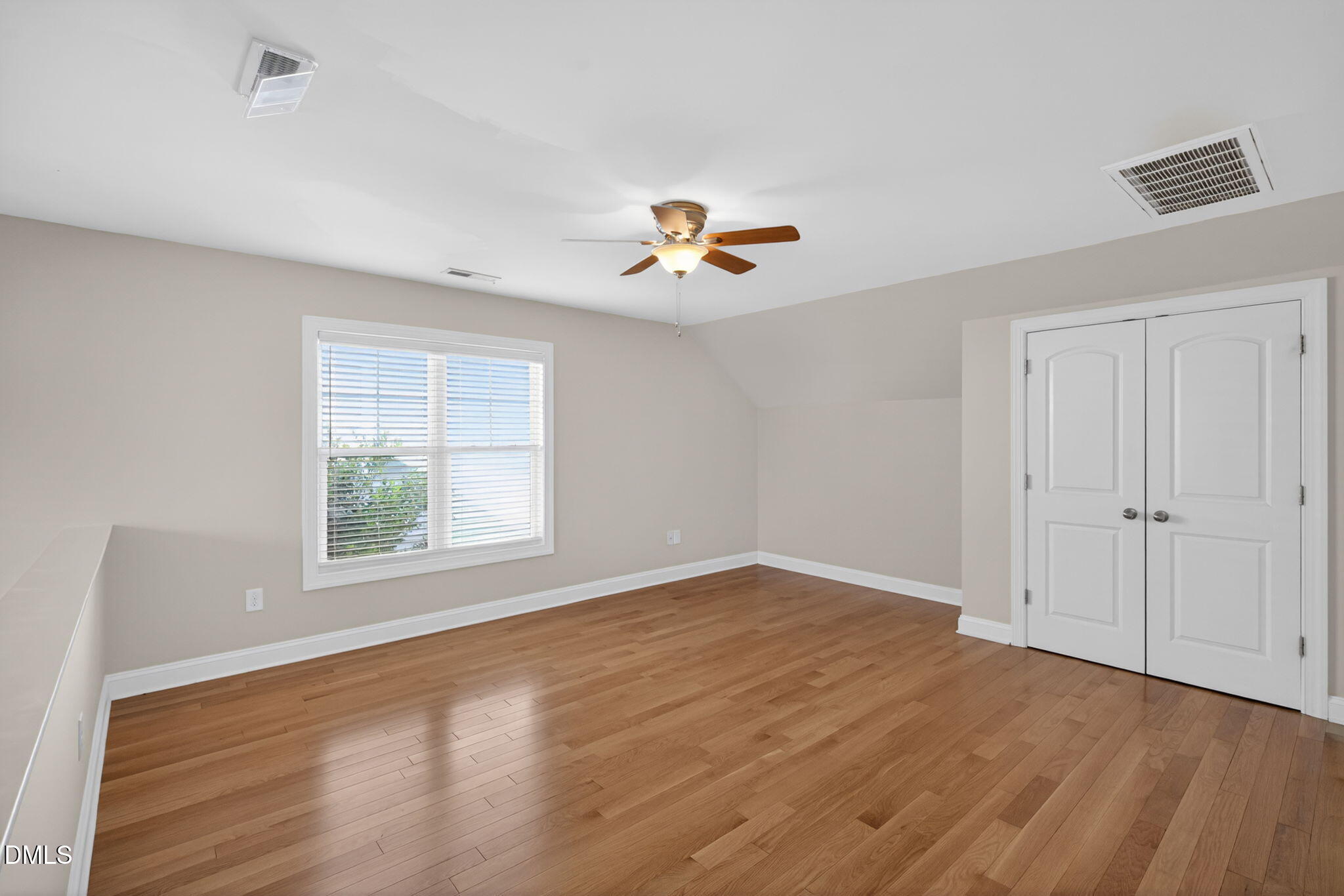 3834 Cumberland Pond Road Raleigh, NC 27606 - Photo 19 of 31 wooden floor in an empty room with a window