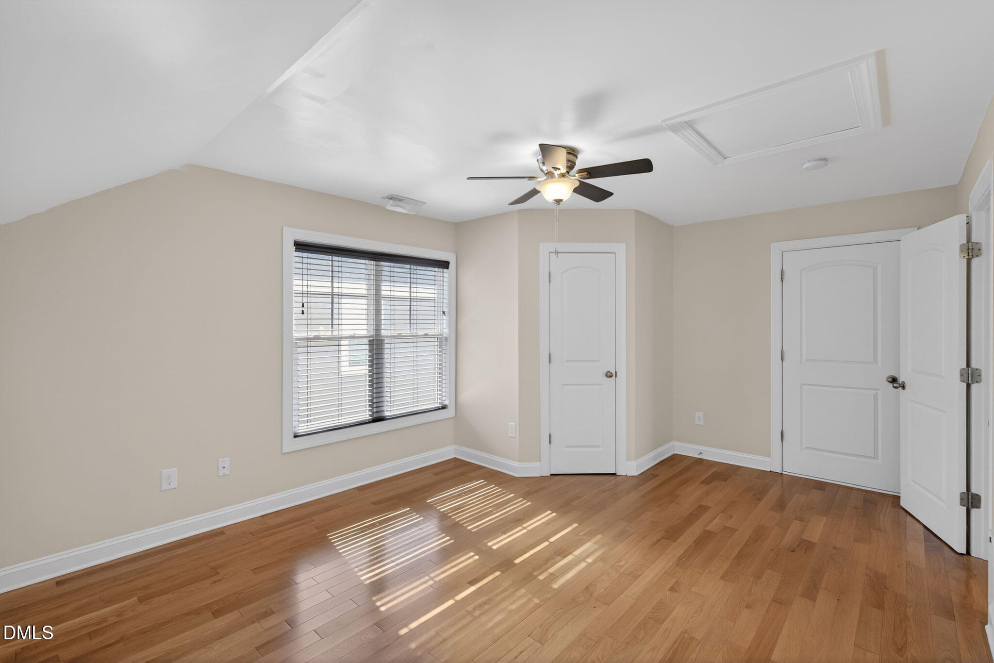 3834 Cumberland Pond Road Raleigh, NC 27606 - Photo 21 of 31 a view of empty room with wooden floor and fan