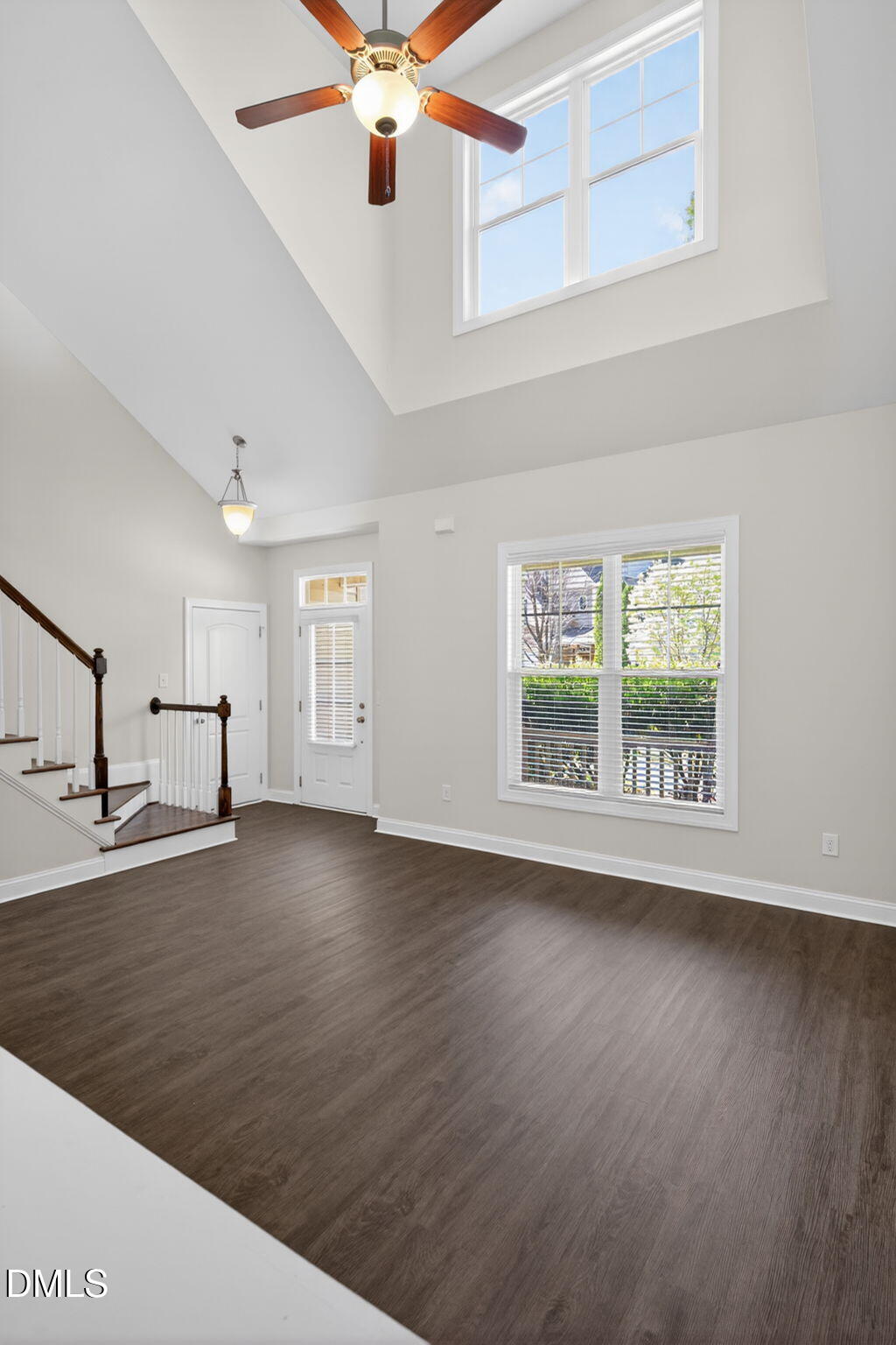 3834 Cumberland Pond Road Raleigh, NC 27606 - Photo 2 of 31 a view of an empty room with window and wooden floor
