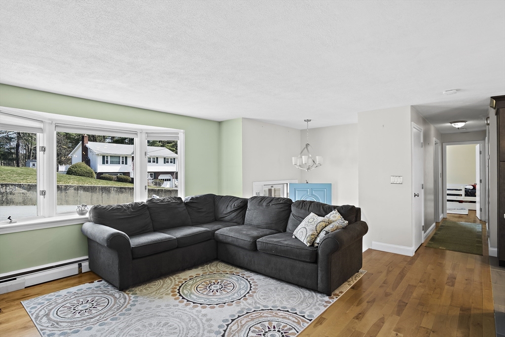 29 Dix Rd Extension Woburn, MA 01801 - Photo 13 of 40 a living room with furniture and a large window