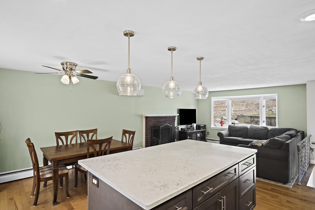 29 Dix Rd Extension Woburn, MA 01801 - Photo 15 of 40 a view of a dining room with furniture a chandelier and wooden floor