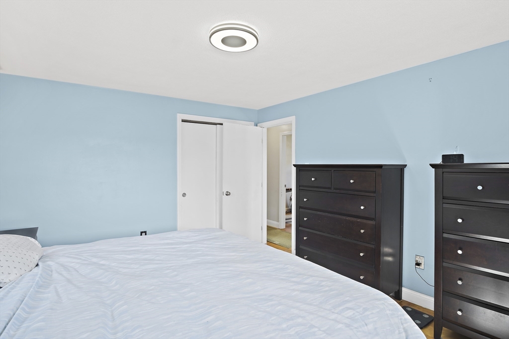 29 Dix Rd Extension Woburn, MA 01801 - Photo 22 of 40 a bedroom with a bed and a dresser