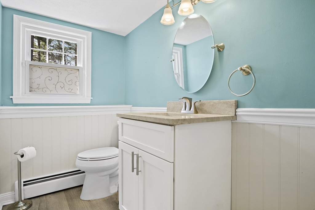 29 Dix Rd Extension Woburn, MA 01801 - Photo 28 of 40 a bathroom with a toilet sink and mirror