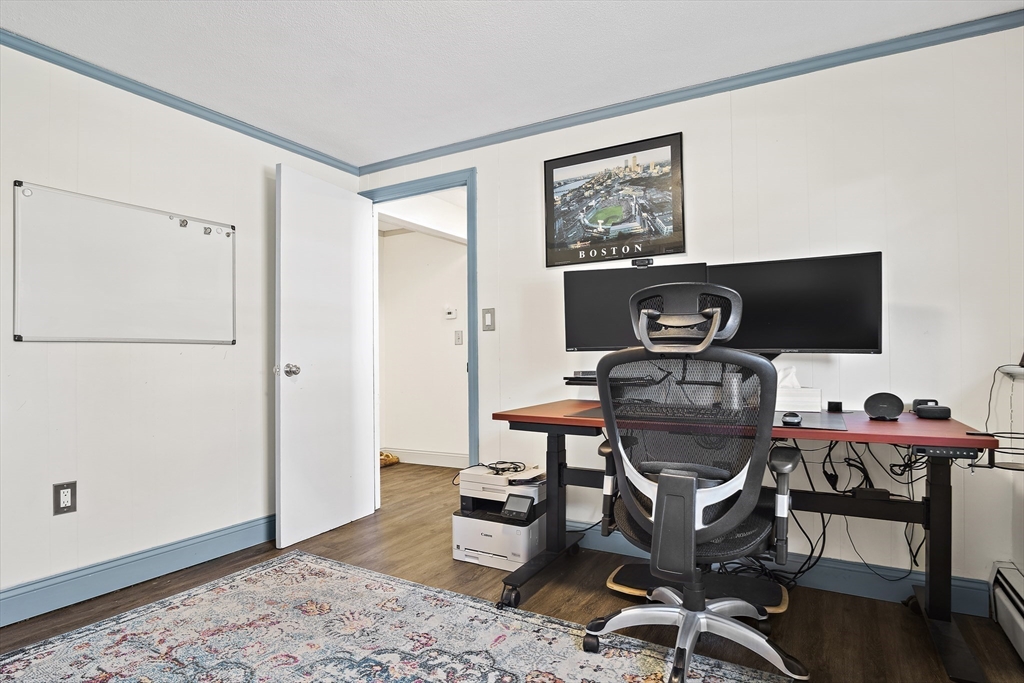29 Dix Rd Extension Woburn, MA 01801 - Photo 30 of 40 a view of a workspace with furniture and wooden floor